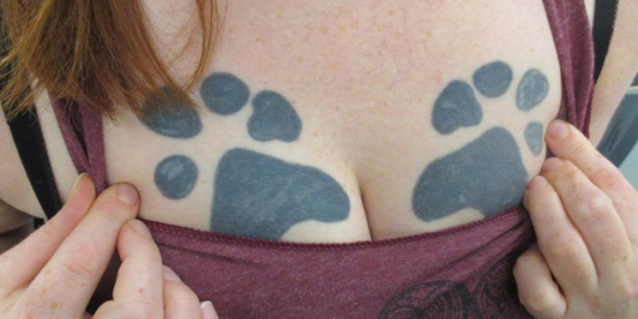 Girl with paw prints tattoed on her boobs is sick of being called 'paw t*ts'
