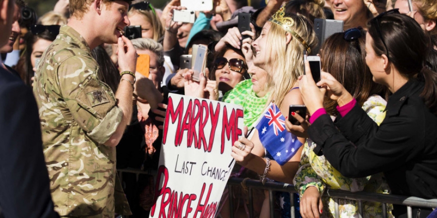 Crazy woman plans to travel from Australia to stand outside royal wedding and convince Harry to dump Meghan