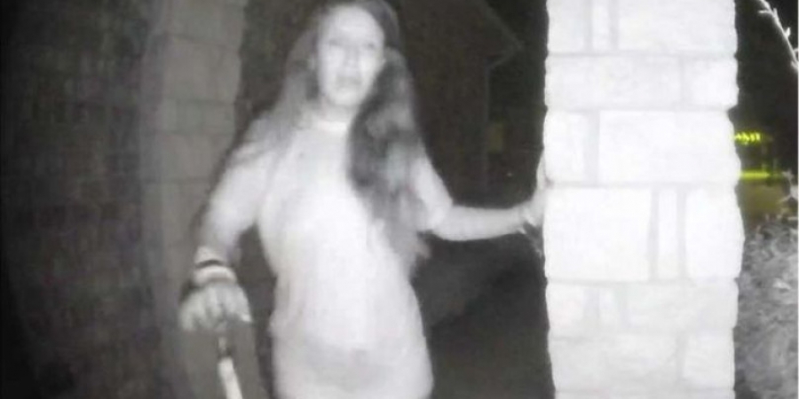 Woman wearing wrist restraints filmed ringing doorbells in the middle of the night