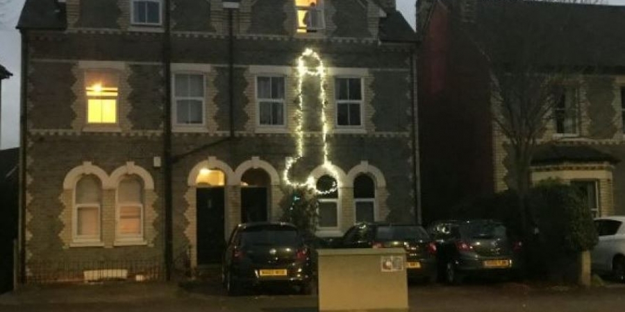 Someone decorated their house with a giant flashing cock and balls!