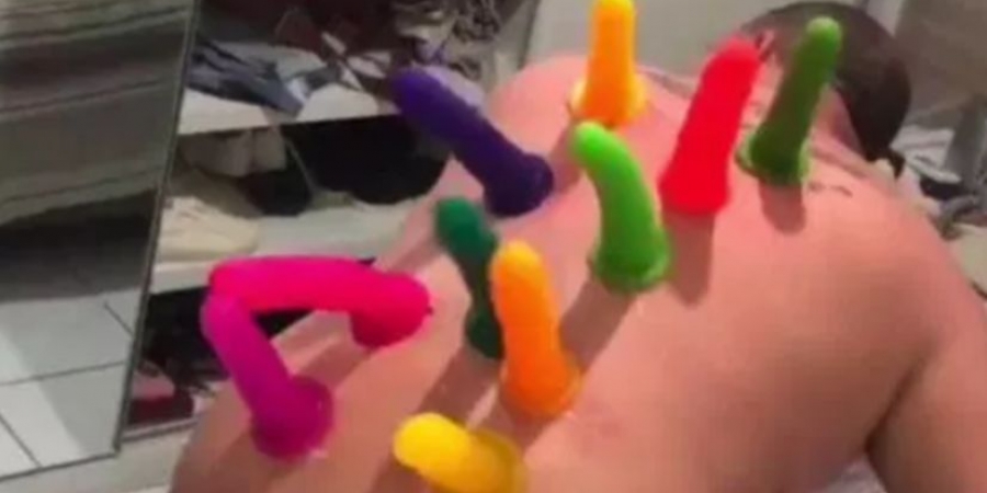 Dude superglues 10 dildos to his drunk mates back!
