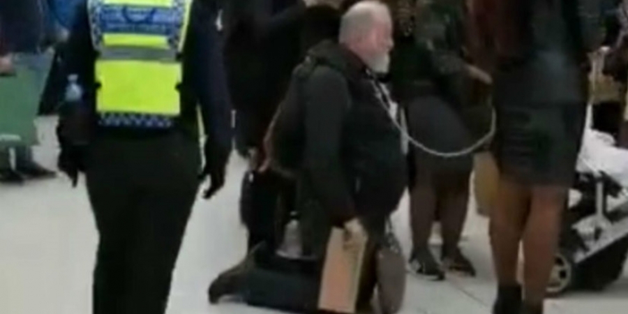 A dominatrix was filmed walking her slave through Waterloo station