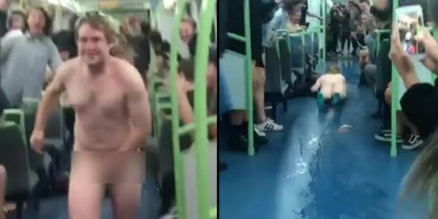 Naked dude slides down middle of packed train carriage
