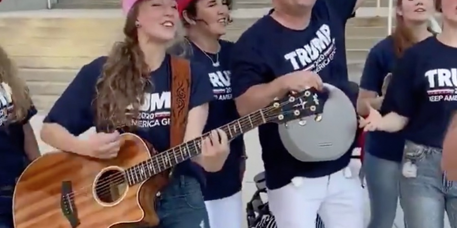 Trump supporters assault the ears of passers-by with cringe song ahead of election