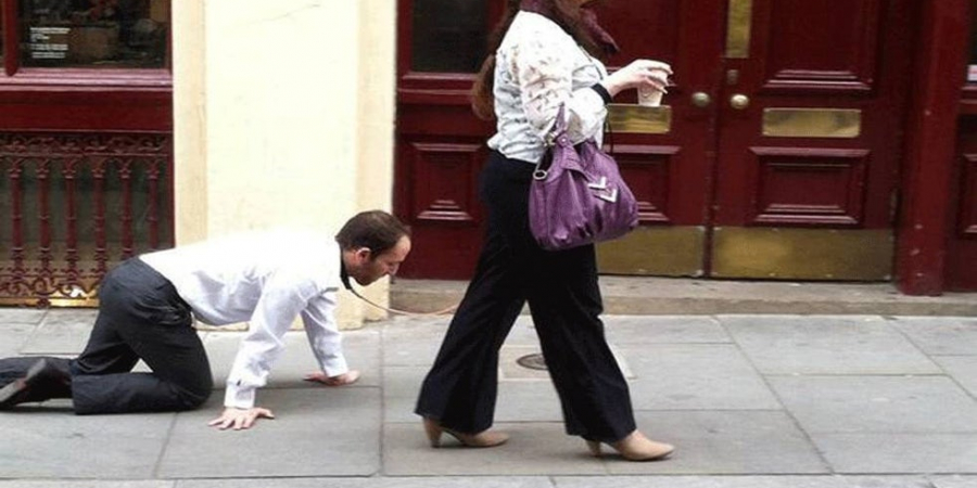 Woman walks dude on a lead to get round Quebec lockdown rules